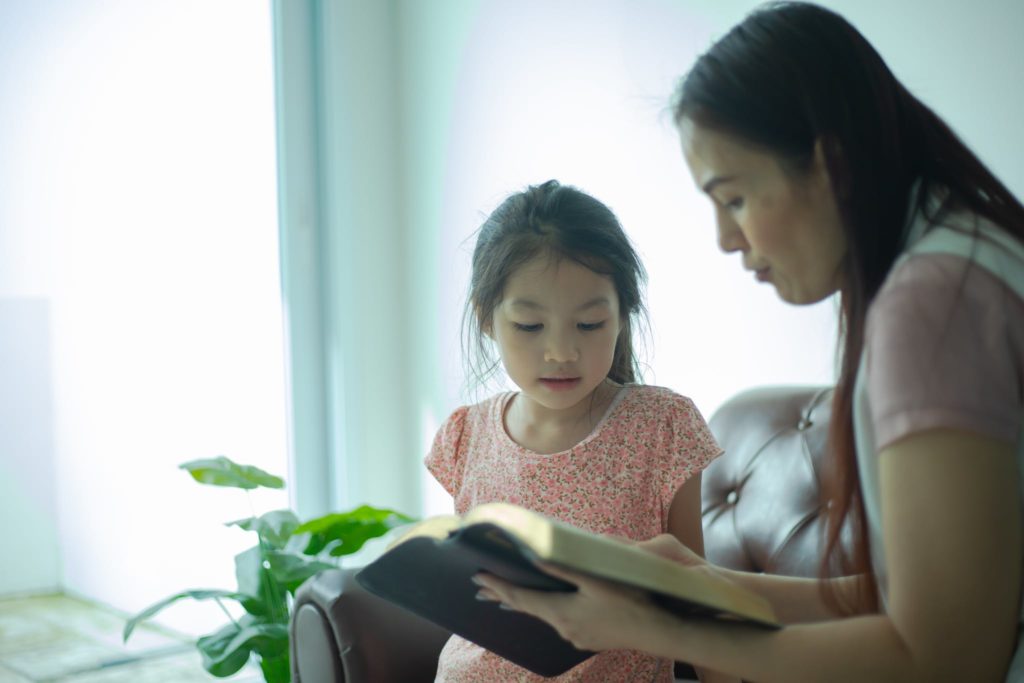 Mother Teaching Her Cute Daughter