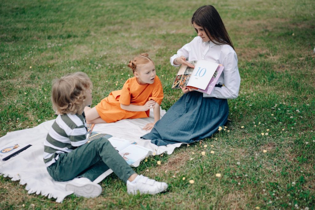 A Woman Teaching the Boy and Girl