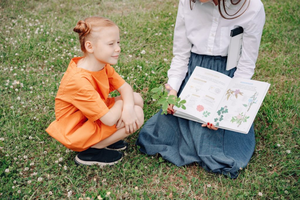 A Young Girl Looking the Book